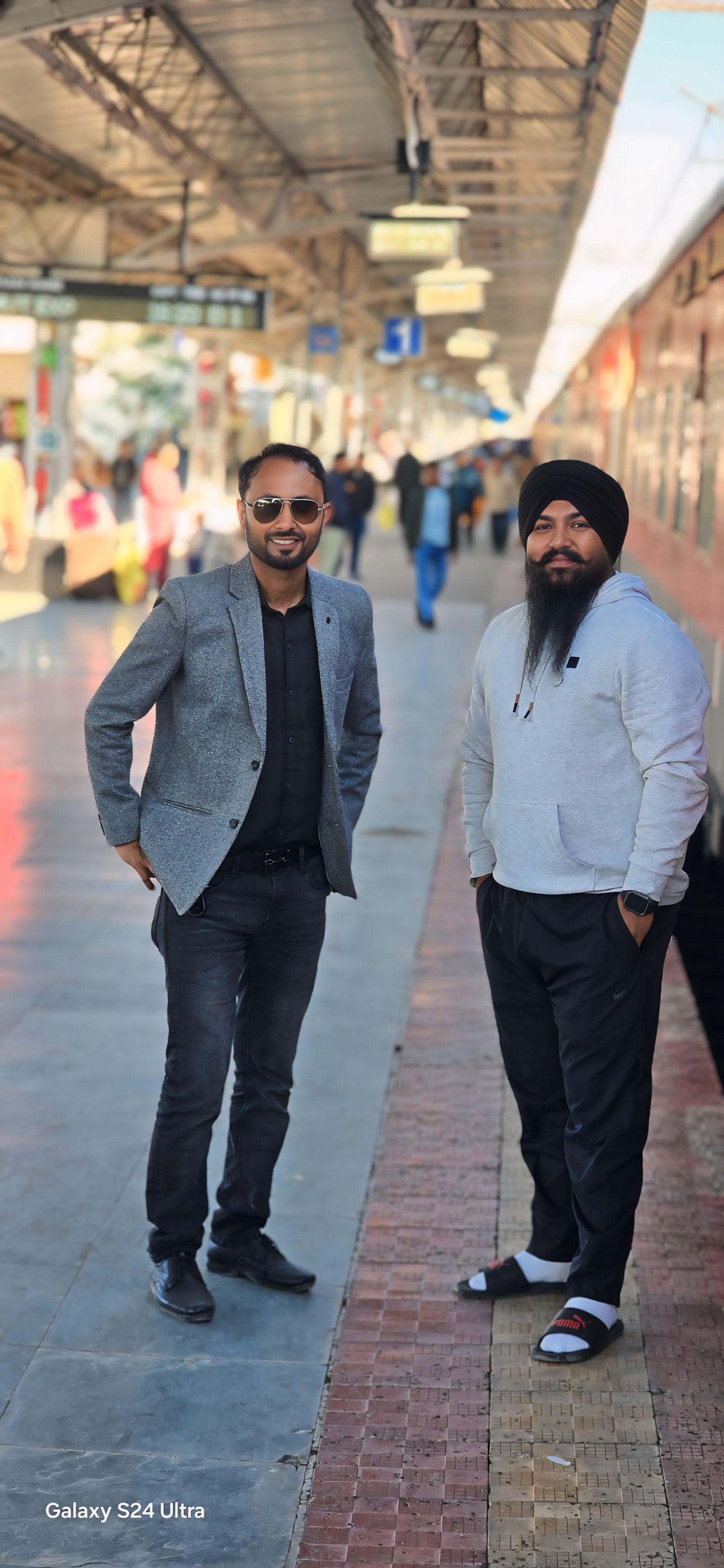 Travel portrait on railway platform in formal blazer and turban - Professional appearance during journey