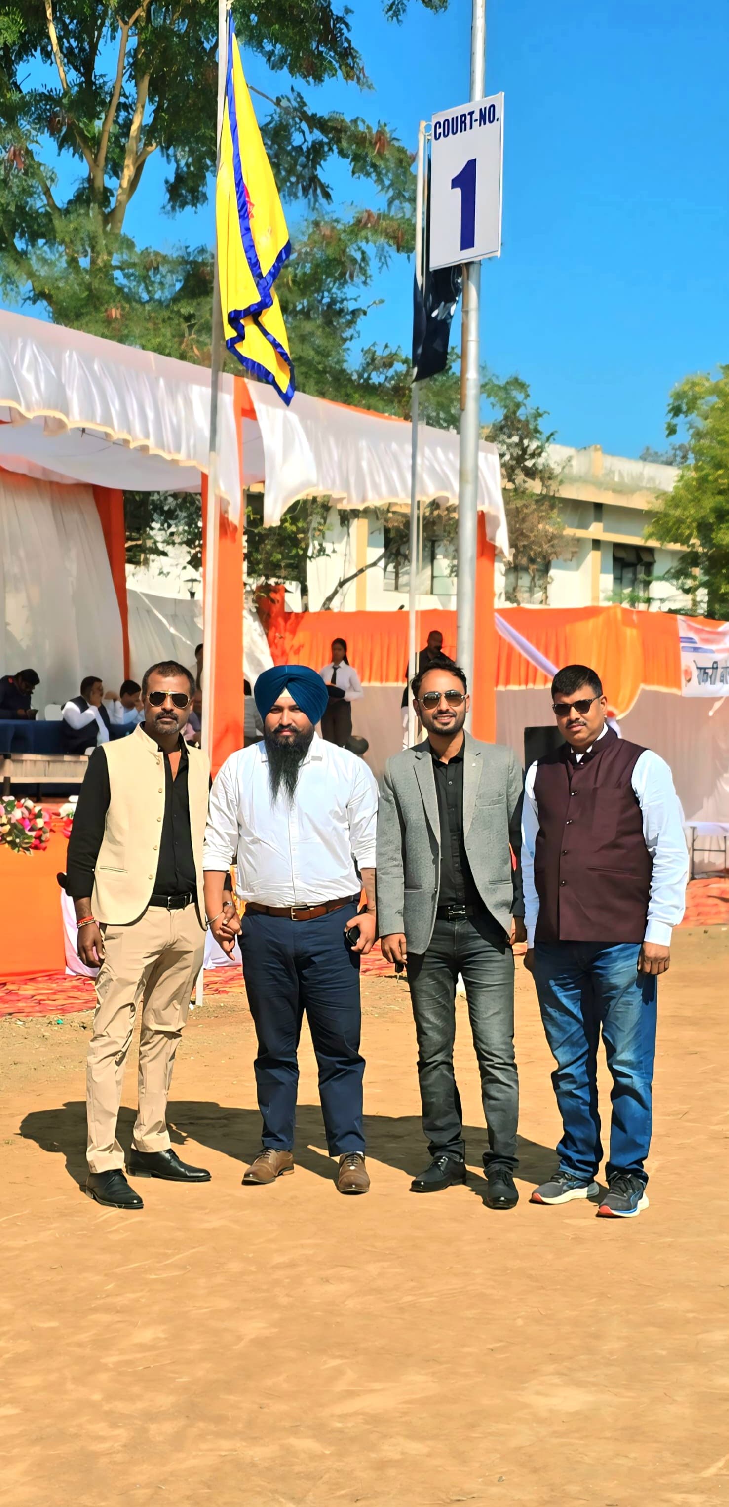 Sports event venue group photo on court - Officials and participants gathered at sports competition venue